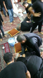 Shia mourners injured following a police raid.